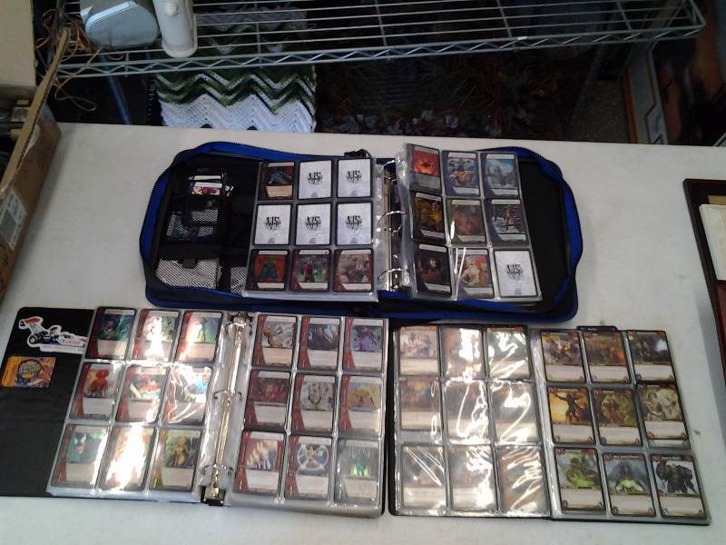 lot 133 image: 1-Large Album Of World Of Warecraft, 2-VS System Trading Cards