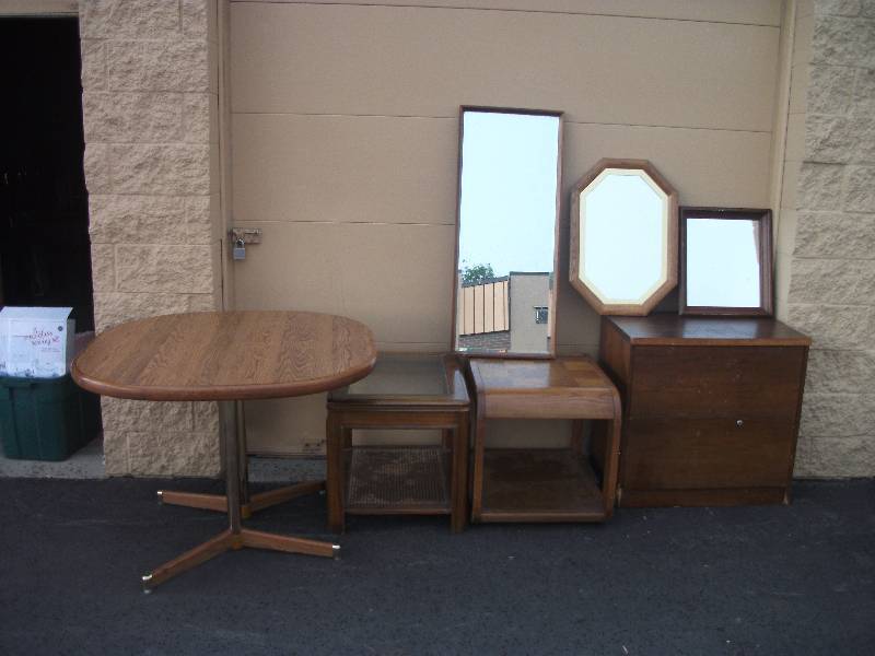 lot 21 image: 1-Kitchen Table, 2-End Tables, 1-2 Drawer Cabinet, 3- Assorted Wood Frame Mirrors