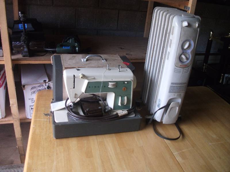 lot 23 image: Singer Model 717 Portable Sewing Machine, Honeywell Heater