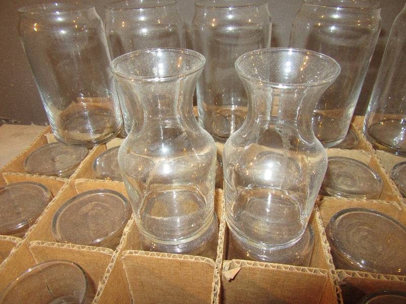 lot 180 image: 25, No 719, 6 oz cocktail decantersbud vases.. 5 glasses with a unique brim that is smaller than body