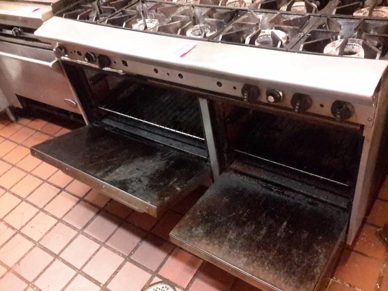 lot 1 image: 10 Burner Commercial gas stove and 2 part oven.. Works well.. You must unhook this from the gas yourself and bring your own loading help to get out.. On main floor not too far from the door.