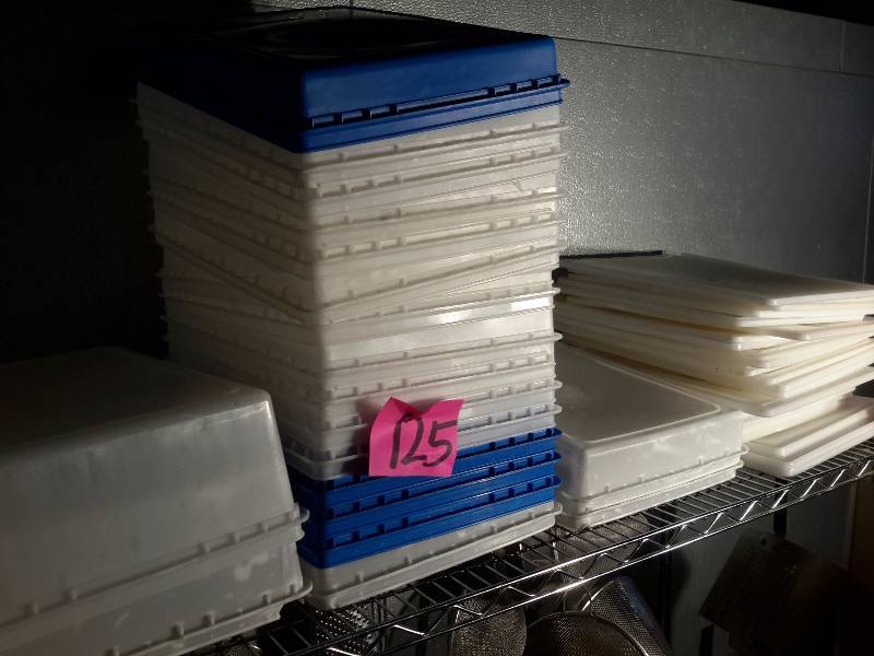 lot 125 image: Plastic containers and covers.