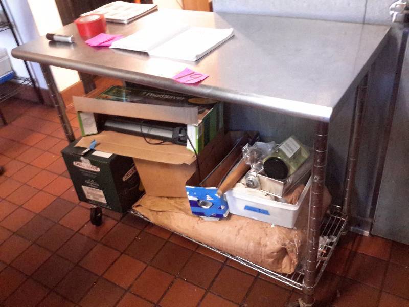 lot 19 image: Stainless Steel work table with bottom shelf. .Locking Wheels
