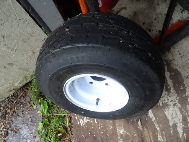 lot 15 image: Spare trailer tire. 5 hole rim. 18....