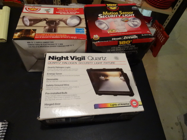 lot 62 image: Qty 2 motion sensor lights and 1 fl...