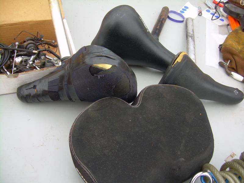 lot 107 image: BIKE SEATS, LOCKS , AND PARTS