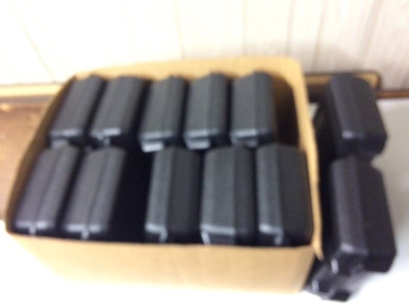 lot 46 image: 12 Black Hard Plastic Handled Cases