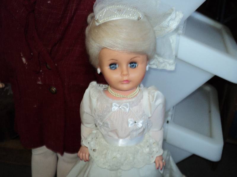 2 vintaqge dolls...