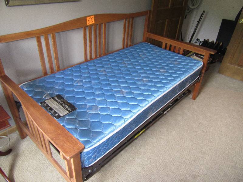Oak Trundel Bed.. Has tuck under.