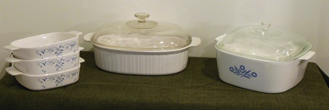 lot 102 image: 4-Quart Square Corning Ware, 4-Liter Oval Corning Ware, and 3 small Corning Ware Oven-Safe Pieces without lids