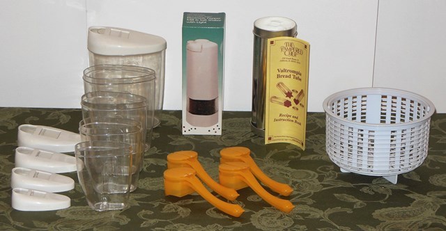 lot 130 image: New In Box Electronic Pepper Mill and Salt Shaker with Light, Pampered Chef Valtrompia Break Tube, Kitchen Storage Containers, and Corn on the Cob ButterSalt&Pepper Dispensers