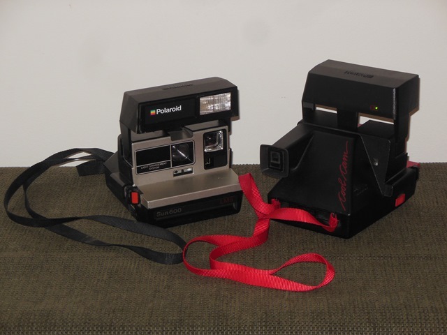lot 162 image: Two Polaroid Cameras - Sun600 and Cool Cam 600