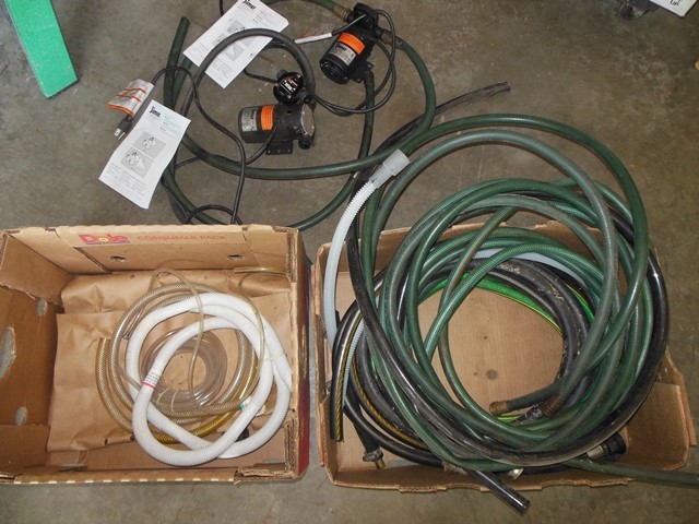 lot 155 image: Two Simer Minivac Pumps, One Drill Pump, and Assorted Hoses
