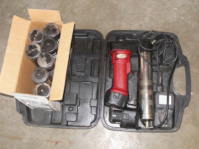 lot 173 image: Legacy Cordless Grease Gun with Case, Spare Battery, and 7 Extra Tubes of Grease