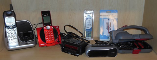 lot 309 image: Phones (Uniden has no power cord), Clocks, Eddie Bauer Convenience Kit and More
