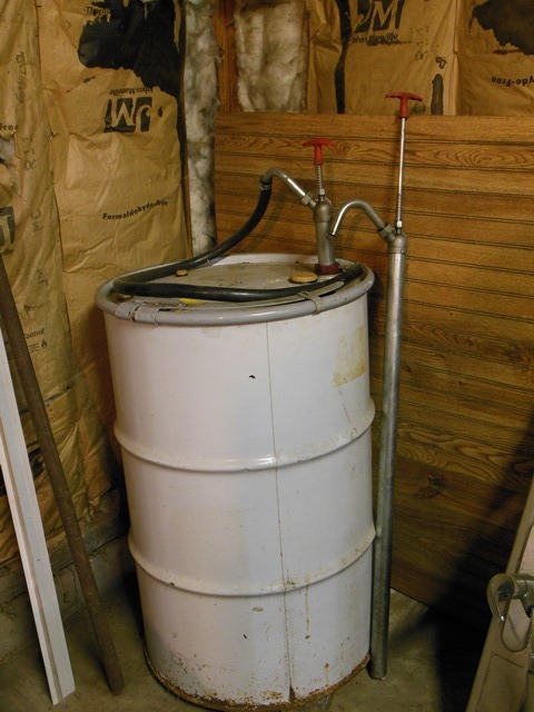 lot 273 image: Barrel with Pump (includes contents), Extra Pump, and Barrel Clamps