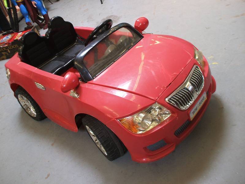 lot 228 image: POWER WHEELS WITH BATTERY AND CHARGER