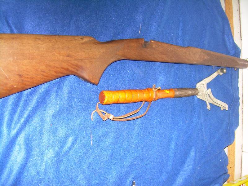 GUN STOCK AND A CLAY PIGEON THROWER