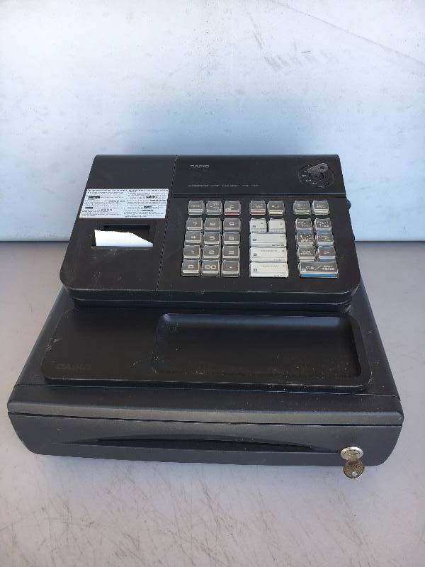 lot 73 image: Casio Cash Register w Extra Reciept Spools