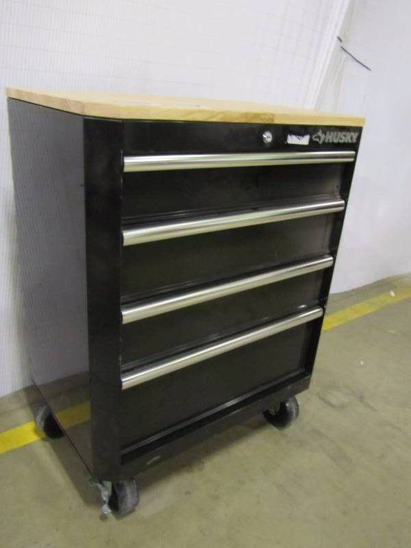 lot 56 image: Husky 33 in. H x 28 in. W x 18 in. D Steel 4-Drawer Garage Base Cabinet