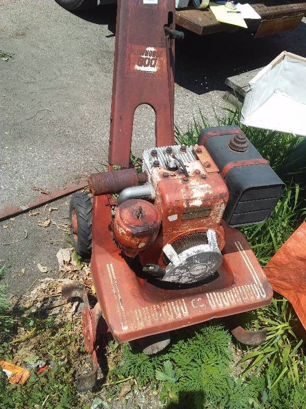 lot 26 image: Coast to Coast Rototiller Plowmore 800, Briggs and Stratton Engine (good condition) 2 gear teeth broken in transmission housing.