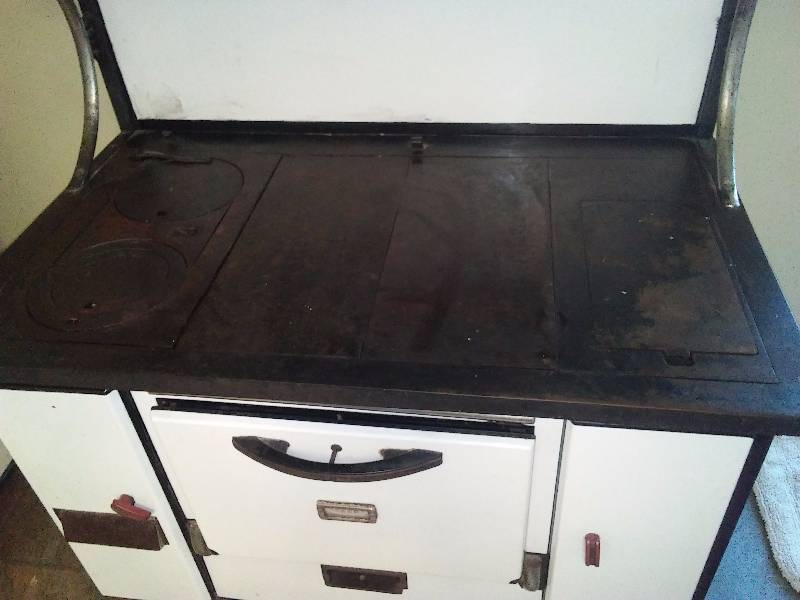 lot 108 image: Antique enamel and cast wood stove. Immaculate condition.