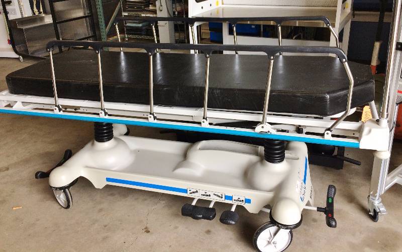 lot 1 image: Retails New $6000 - Super Nice Stryker 721 Bariatric 500lb Capacity Patient Transport Transfer Bed HiLow Tilt Forward & Back Gurney Stretcher EMS OR Hospital Emergency Ambulance Mobile Easy Steer Multi-adjustable Rolling - Comes With Free Pad