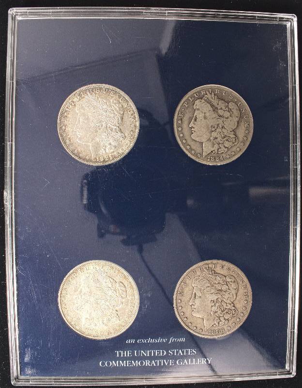 lot 62 image: GROUP OF 4 MORGAN SILVER DOLLARS 1921-S, 1884-O & 1883-P & 1921-D