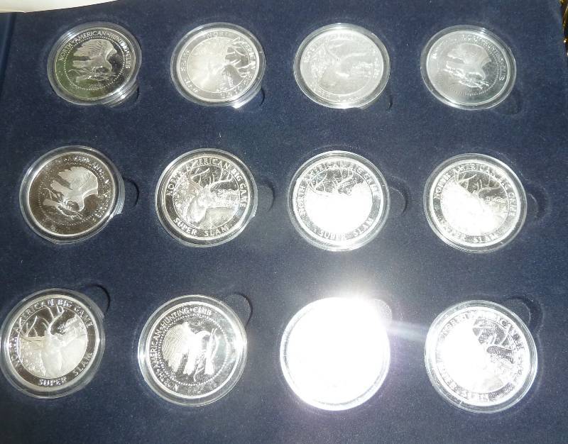 lot 76 image: 12 silver plated whitetail deer coi...
