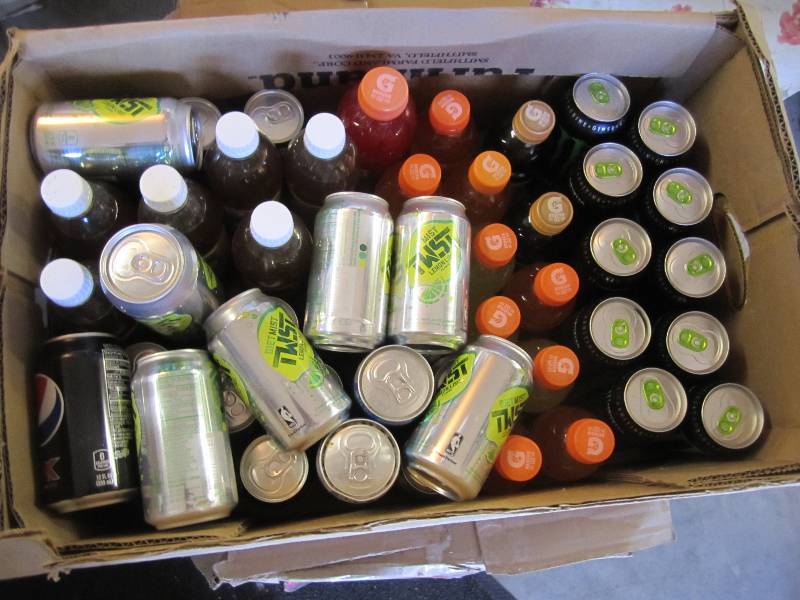 lot 51 image: Box of various canned and bottled d...