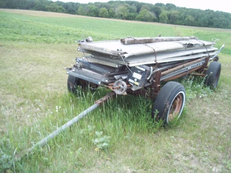 lot 8 image: Wagon running gear with 2 overhead doors and an opener