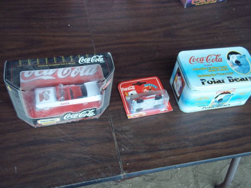 lot 48 image: Coca Cola Collectibles including 2 cars and metal cards