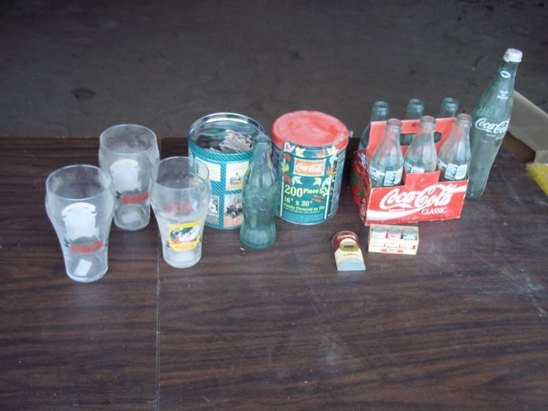 lot 69 image: Lot of Coca Cola items including a 6 pack of bottles, glasses, etc