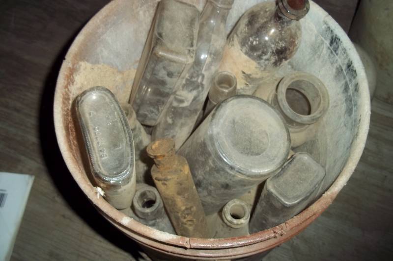 lot 85 image: 5 gal Pail of Vintage bottles
