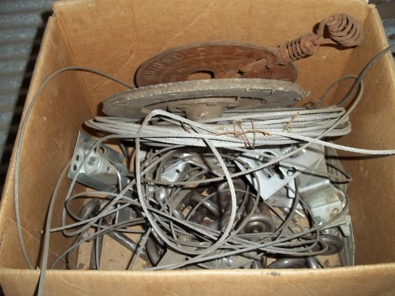 lot 191 image: Box of Garage door cable and cable wheels