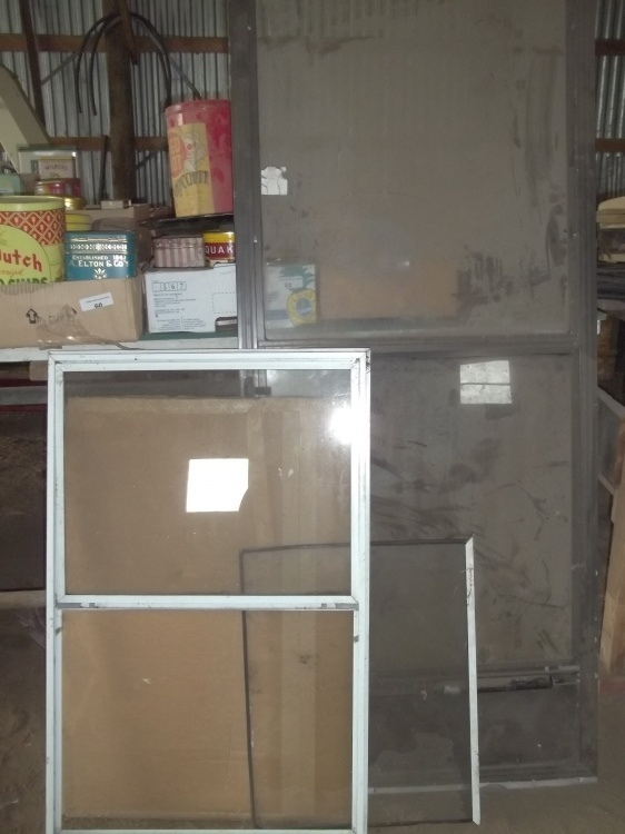 lot 216 image: Storm Door 32 in and window 26 in x 42 in