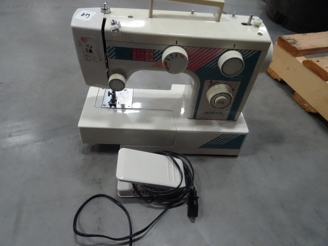 White sewing machine. With foot swi...