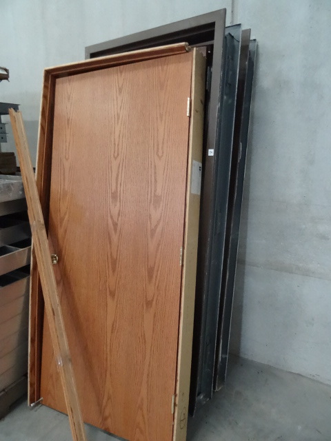 2 metal door frames with wood doors...