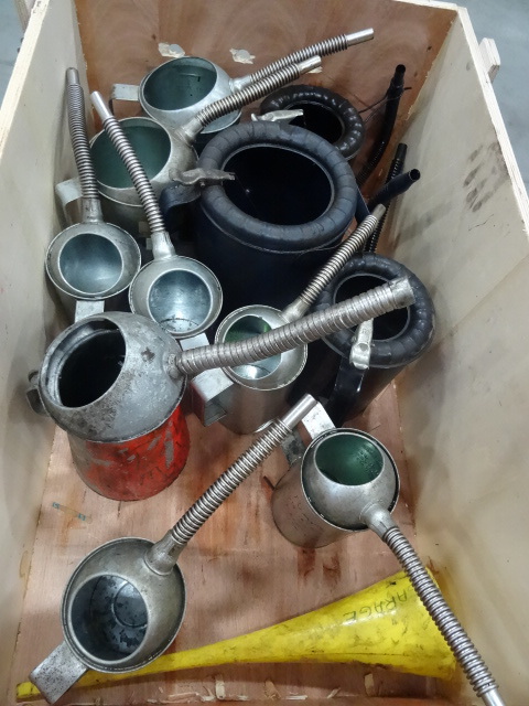 Bin full of misc oil dispenser cans...