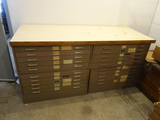 Drafting table with 4 plan files un...