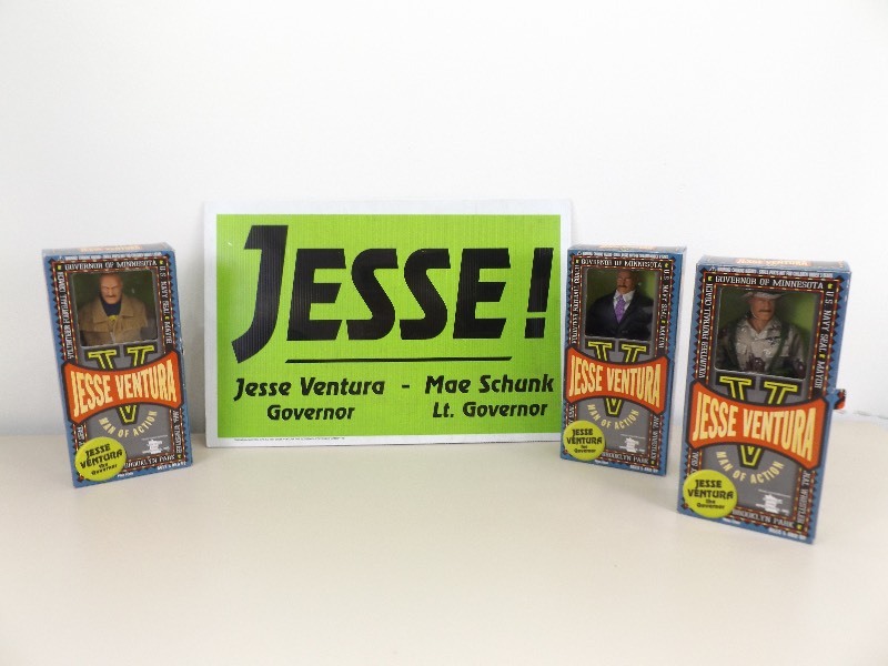lot 26 image: 3 NIB Jesse Ventura Dolls, and Campaigning Sign