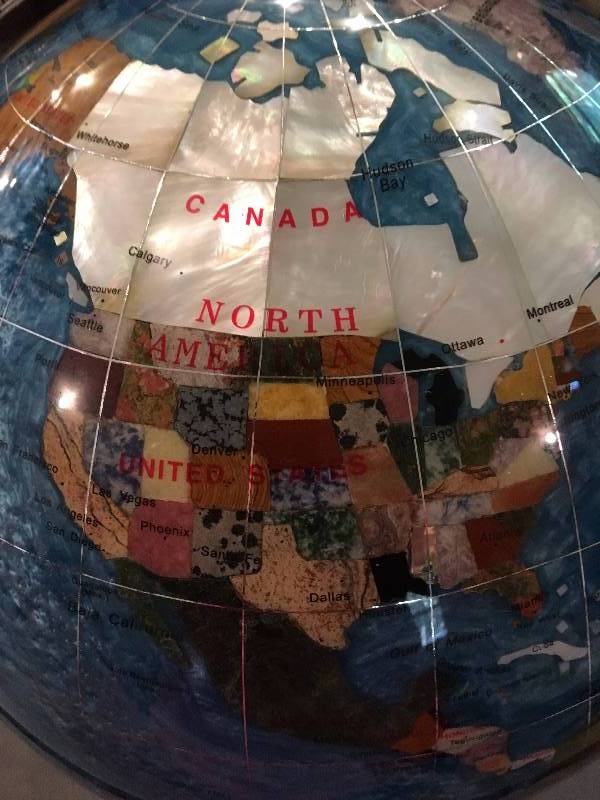 lot 9 image: COLLECTIBLE STONE GLOBE ON STAND