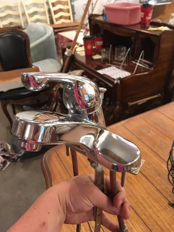 lot 374 image: DELTA FAUCET, HOSE, AND WIRE HANGING BASKET