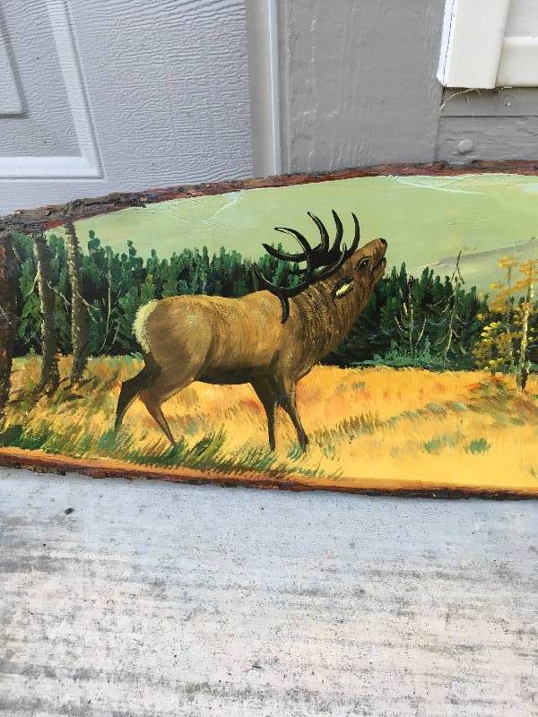 lot 377 image: HAND PAINTED ELK SCENE ON LARGE WOOD SLAB.
