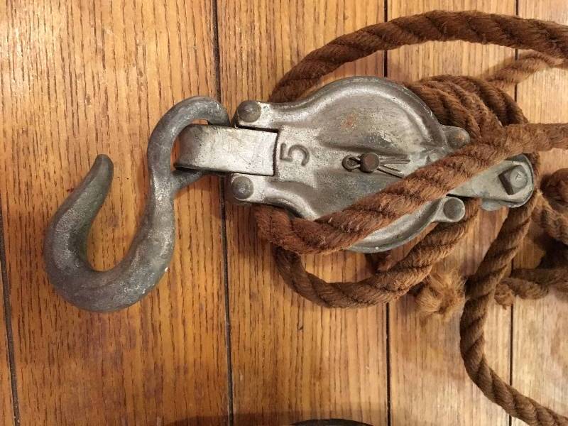 lot 380 image: (2) ANTIQUE PULLEYS AND (1) TOW STRAP