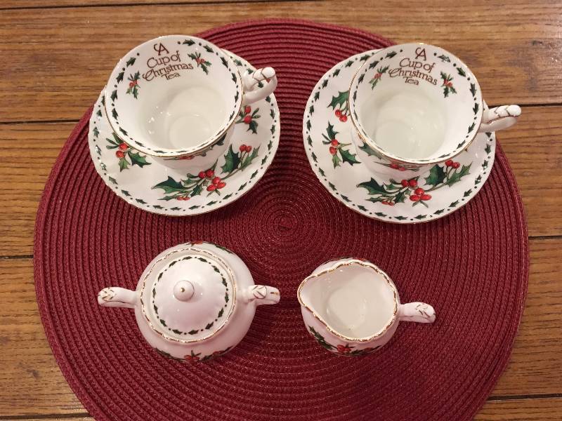 lot 391 image: (2) A CUP OF CHRISTMAS TEA SETS, CREAM AND SUGAR DISHES, AND WICKER MAT.