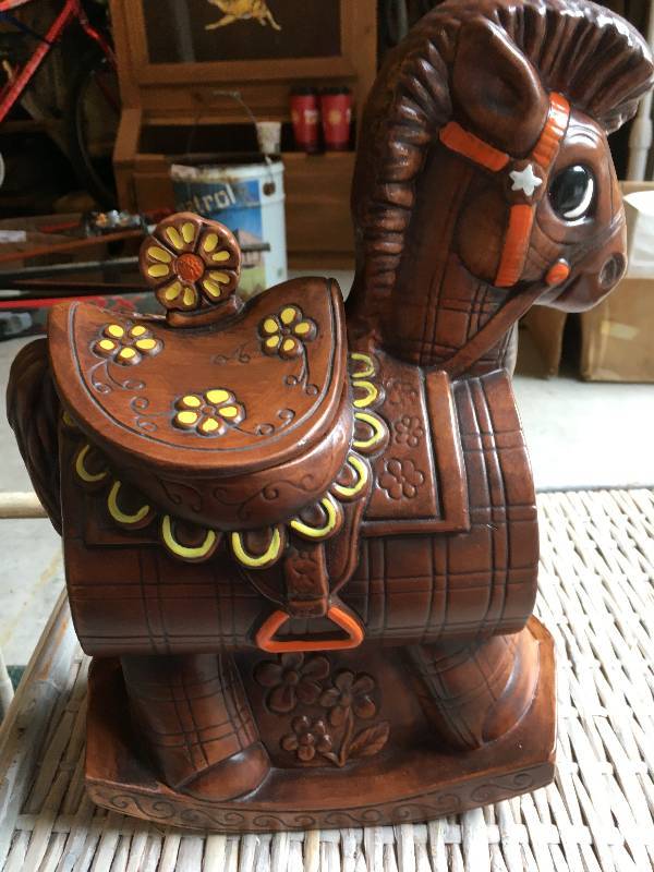 lot 452 image: COLLECTIBLE TROJAN HORSE COOKIE JAR, CASSEROLE DISH, AND WICKER HOLDER.