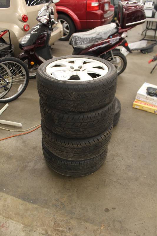 lot 49 image: Lot of (4) Potenza P22545R17 91V Tires w 17in. Wheels