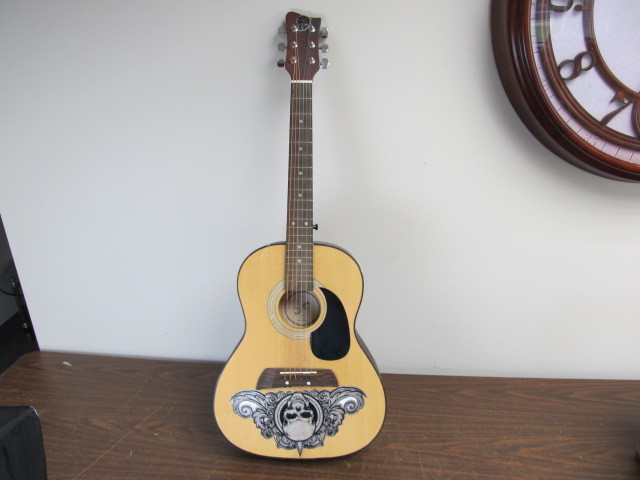lot 61 image: First Act Small Acoustic Guitar