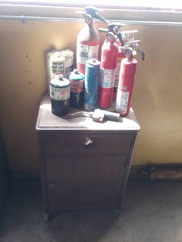 lot 191 image: Vintage Metal Cabinet wSecret Safe, Fire Extinguishers, Propane Tanks, etc